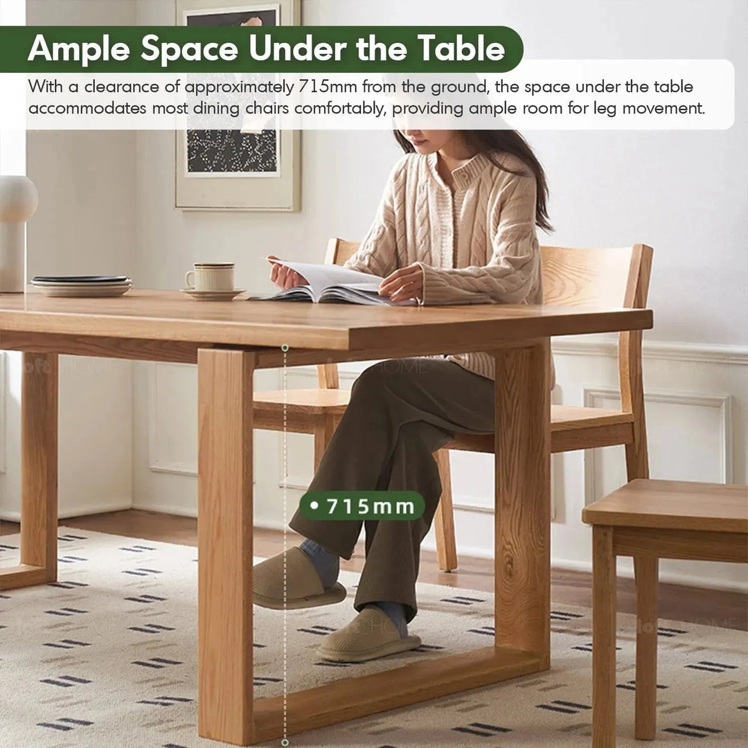 Scandinavian oak wood dining table kumo in panoramic view.