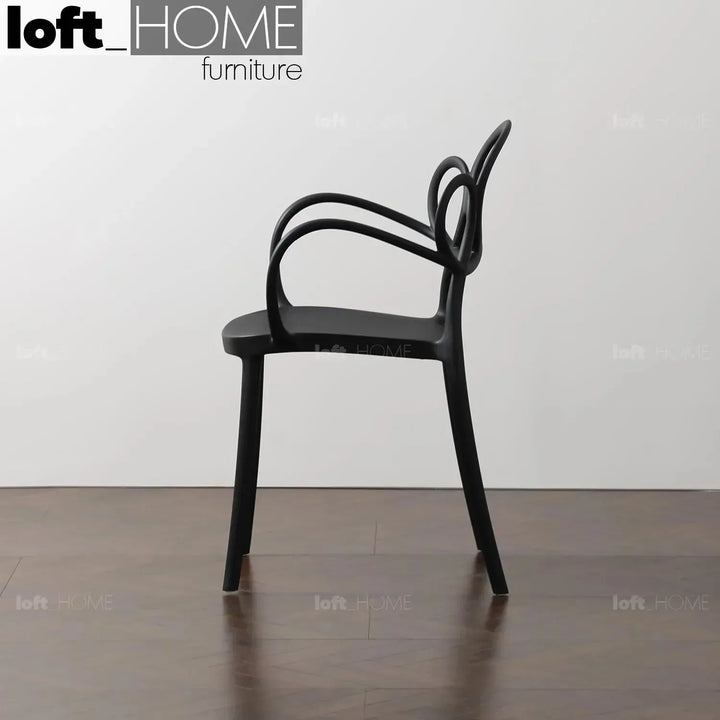 Contemporary plastic armrest dining chair mina with context.