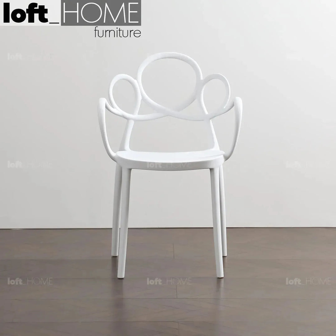 Contemporary plastic armrest dining chair mina material variants.