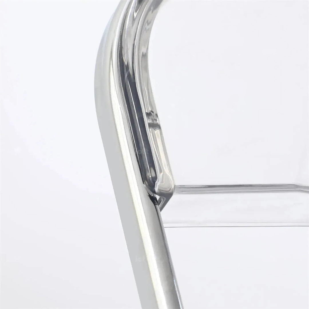 Contemporary plastic foldable dining chair fikas in close up details.