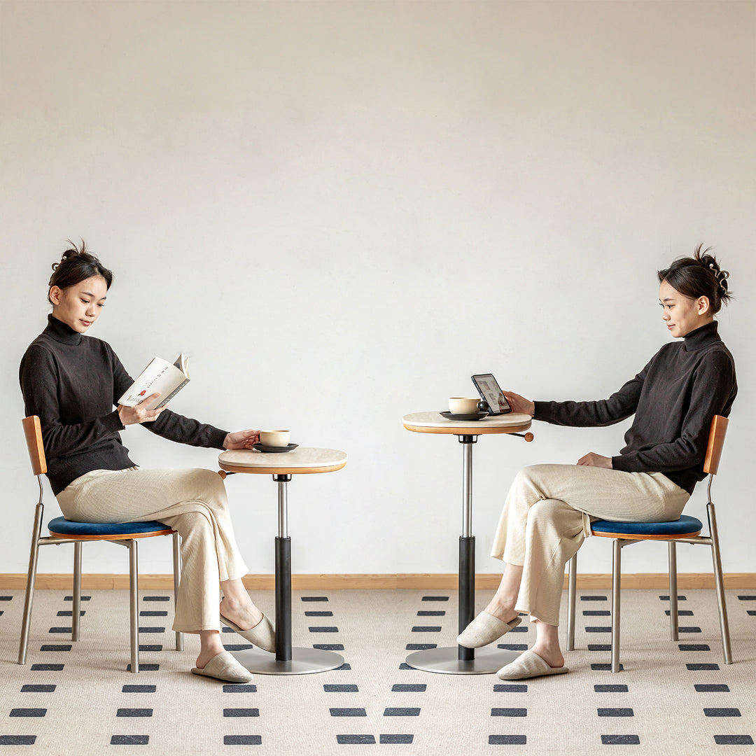 Scandinavian sintered stone height adjustable side table roman in panoramic view.