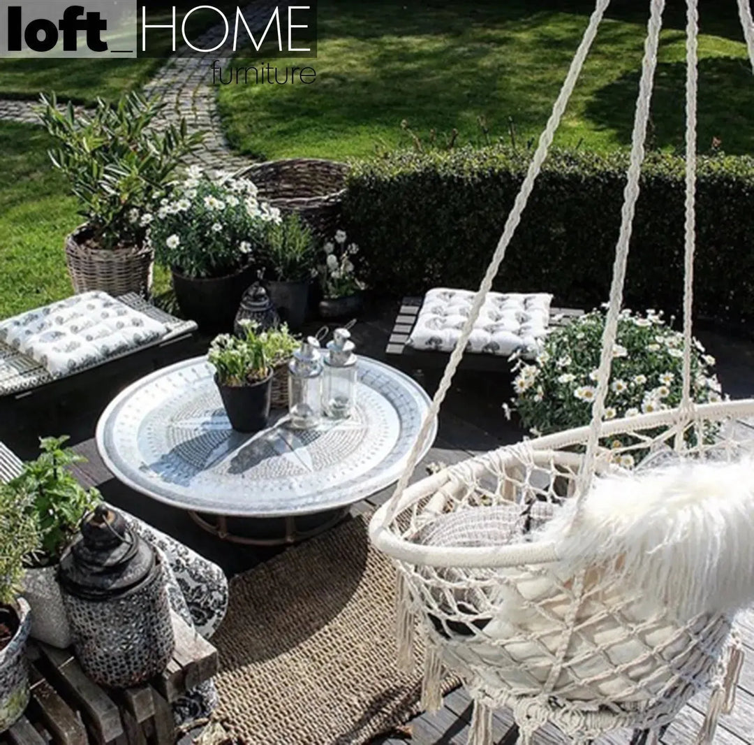 Scandinavian woven rope hanging chair 1 seater sofa net in panoramic view.