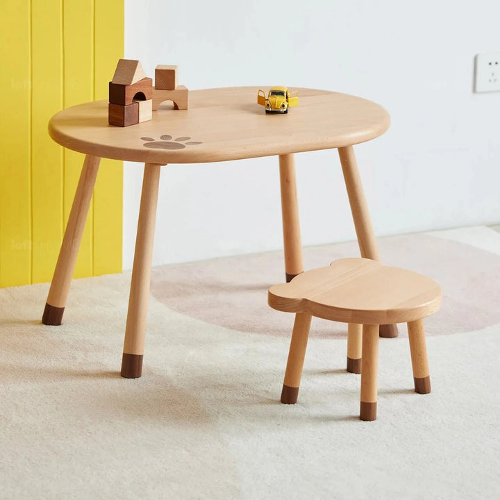 Scandinavian wood kids stool bear in still life.