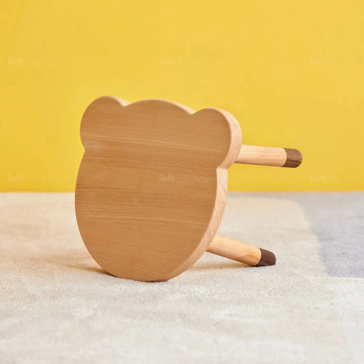 Scandinavian wood kids stool bear in panoramic view.