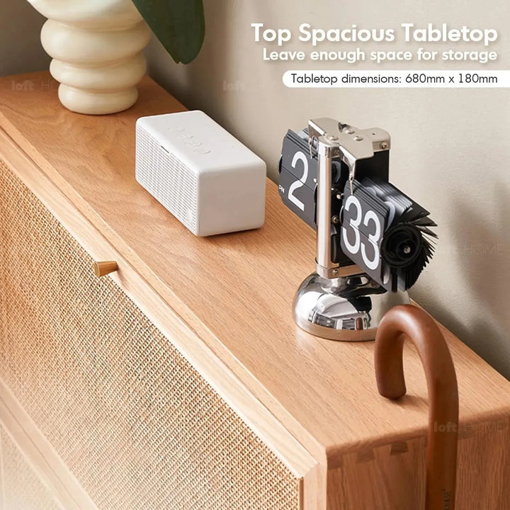 Scandinavian wood shoe cabinet vine weave in still life.