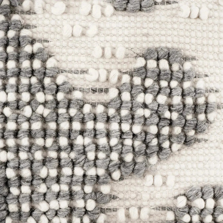 Versatile hand-woven wool looped pillow material variants.