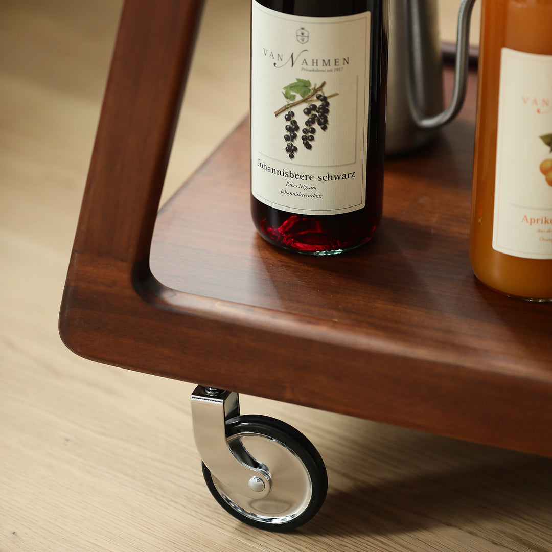 Vintage boxwood wheeled trolley side table yoyo in panoramic view.