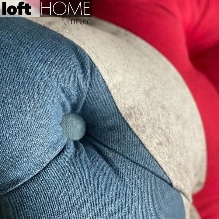 Vintage denim fabric 2 seater sofa union jack chesterfield in close up details.