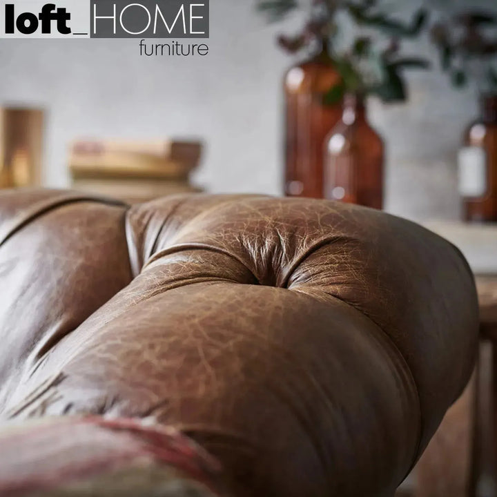 Vintage genuine leather 1 seater sofa chesterfield classic in close up details.