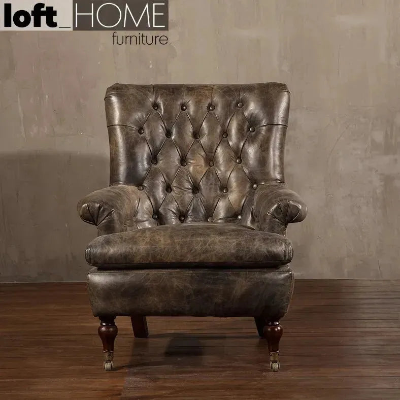 Vintage genuine leather 1 seater sofa retro in close up details.