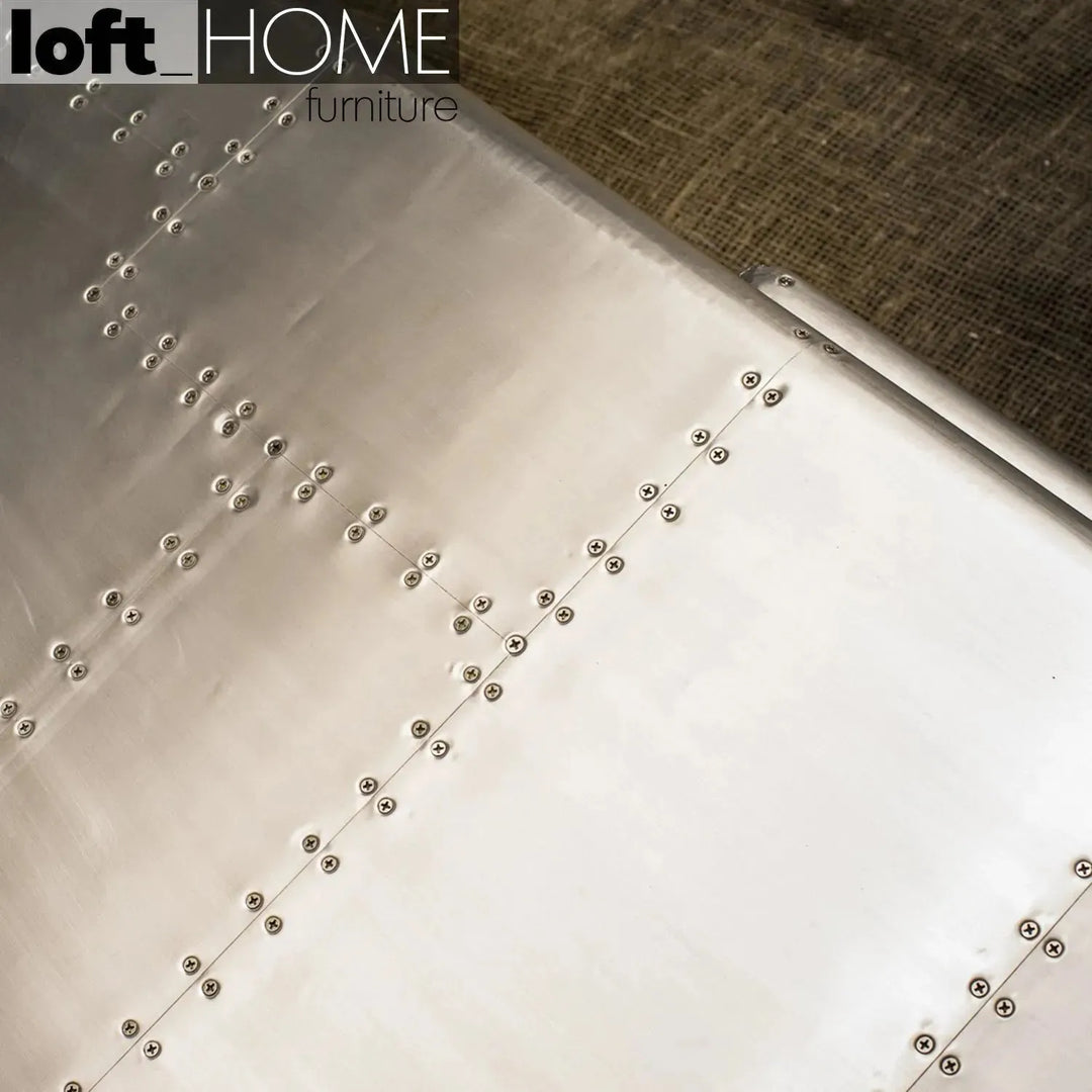 Industrial genuine leather 3 seater sofa silver aircraft in still life.