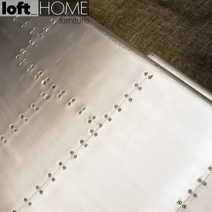 Industrial genuine leather 3 seater sofa silver aircraft in still life.