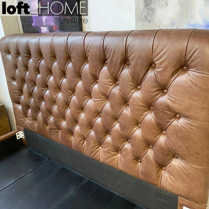 Vintage genuine leather bed frame chesterfield with context.