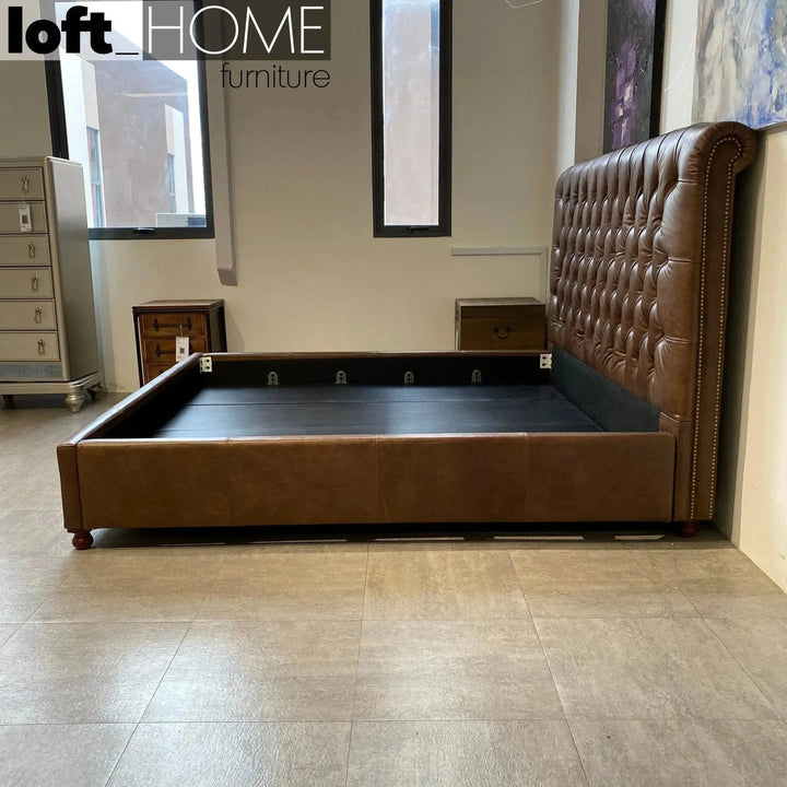 Vintage genuine leather bed frame chesterfield in panoramic view.