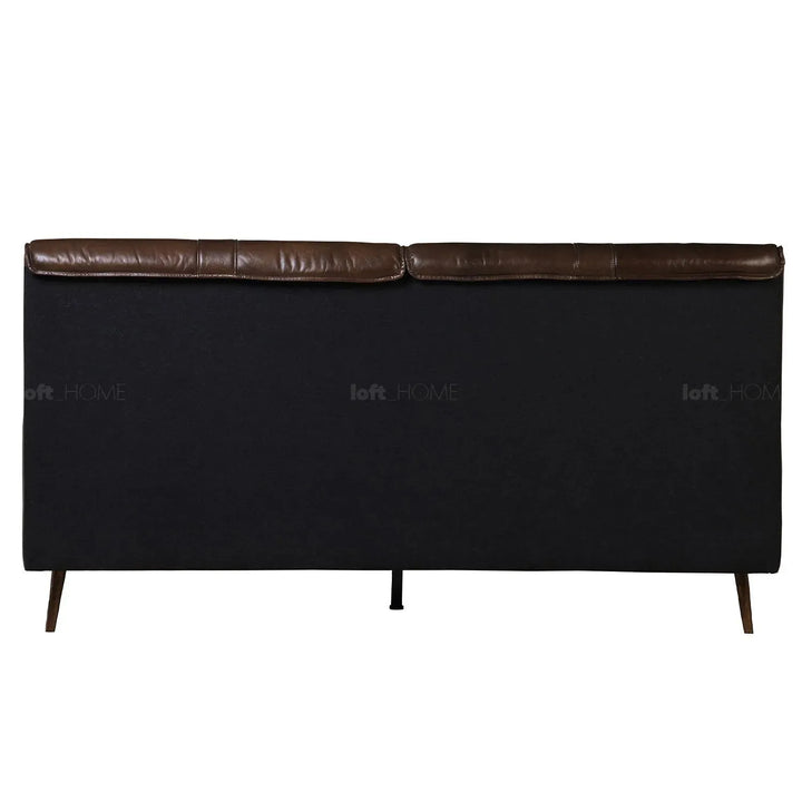 Vintage genuine leather bed frame saddleback in panoramic view.