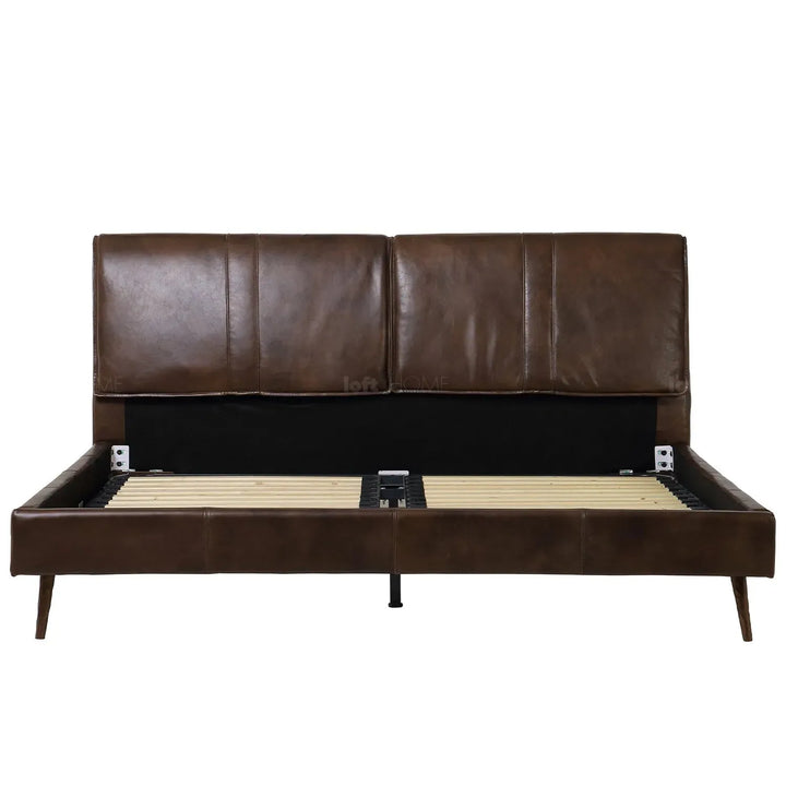 Vintage genuine leather bed frame saddleback in details.