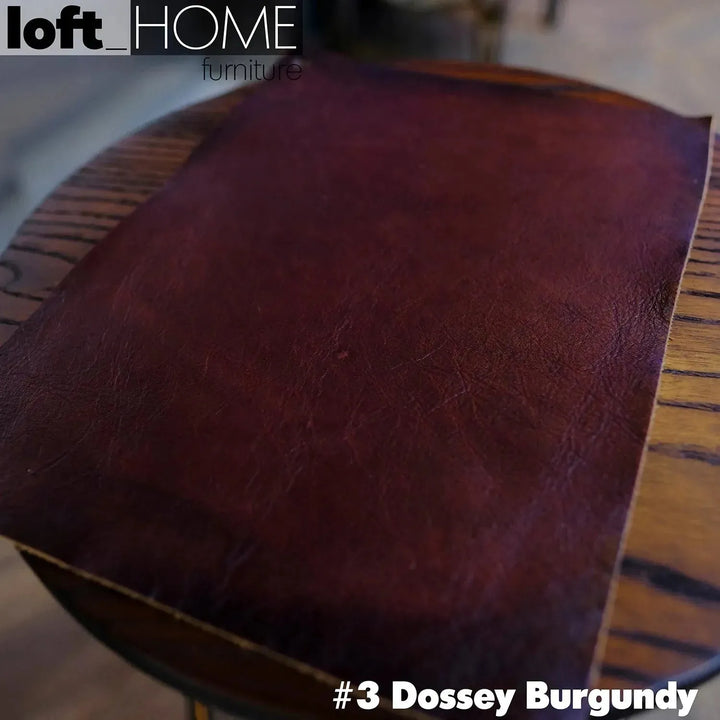 Vintage genuine leather ottoman chesterfield in panoramic view.