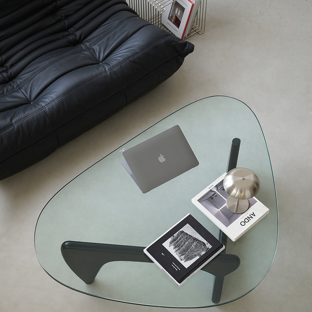 Vintage tempered glass coffee table noguchi in still life.