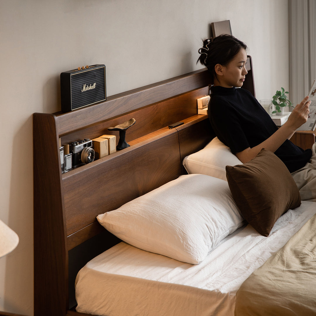 Vintage walnut wood bed accompany light in details.