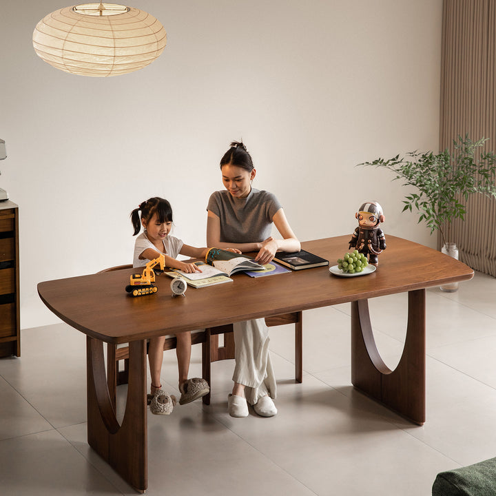 Vintage walnut wood dining table rockwel in real life style.