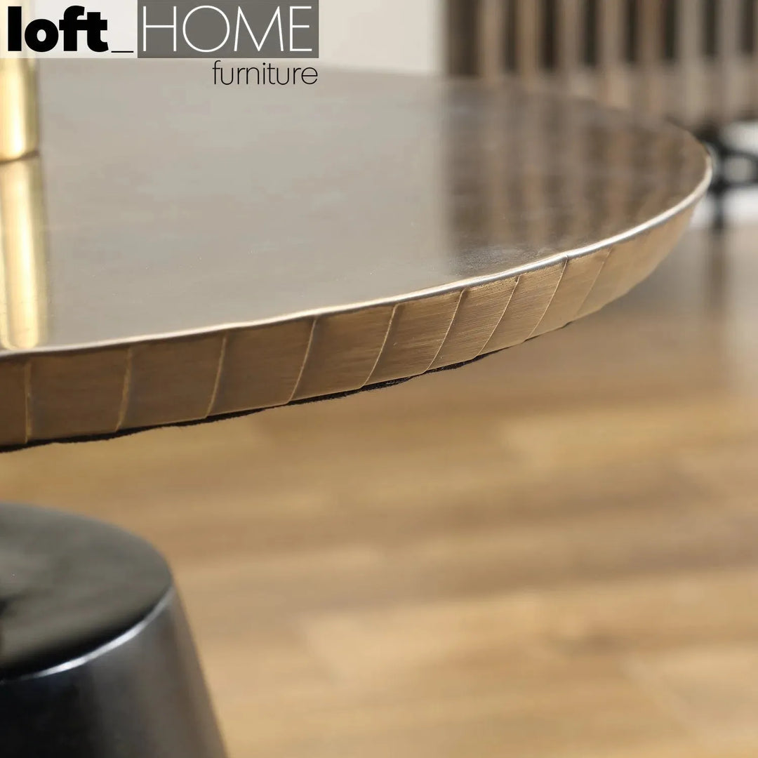 Vintage wooden round side table vintage brass in close up details.